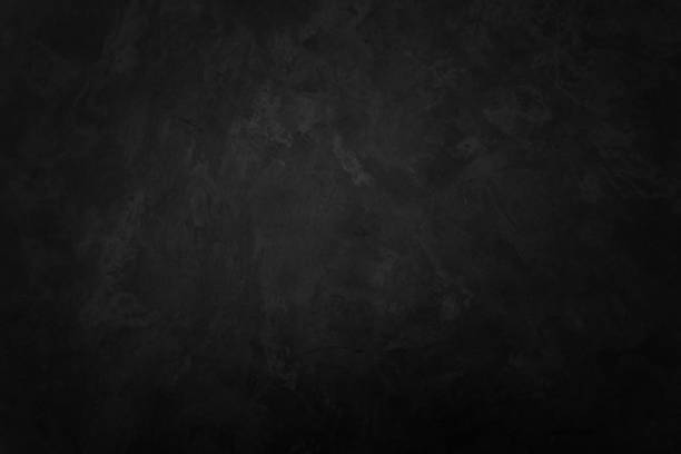 istock Close up retro plain dark black cement & concrete wall background texture for show or advertise or promote product and content on display and web design element concept decor. 1283471599
