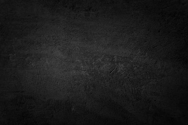 istock Close up retro plain dark black cement & concrete wall background texture for show or advertise or promote product and content on display and web design element concept decor. 1283471834