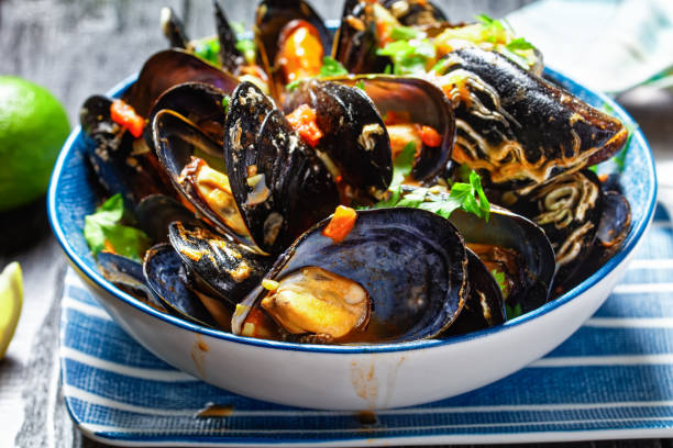 istock steamed mussels with white wine, chopped tomatoes and garlic sauce 1283473293