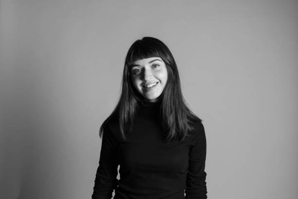 istock Studio portrait of a young woman against plain grey background 1283477412