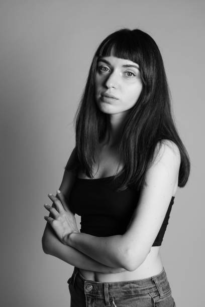 istock Studio portrait of a young woman against plain grey background 1283477479