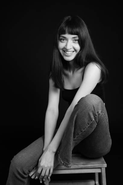 istock Studio portrait of a young woman against plain black background 1283477506