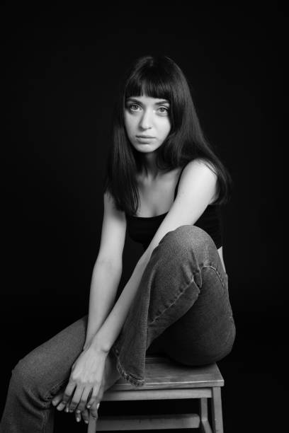istock Studio portrait of a young woman against plain black background 1283477508