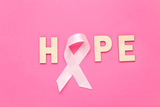 istock Ribbon and inscription Hope on pink background 1283477604