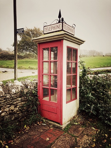 An old fashioned telephone kiosk from the mid twentieth century, Tyneham village, Dorset, UK.