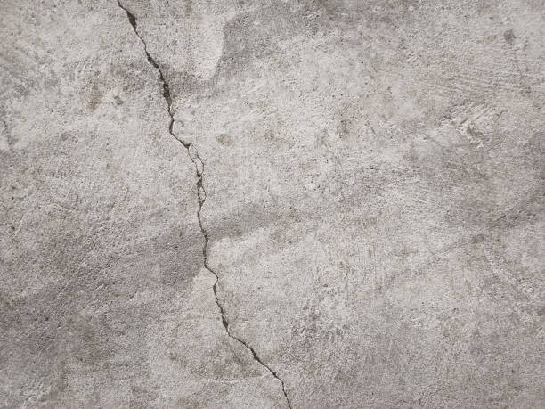 istock Cracked concrete wall texture, Cement background not painted in vintage style 1283478429