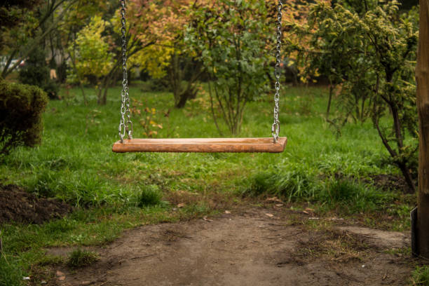 istock wooden swing with nature background 1283479070