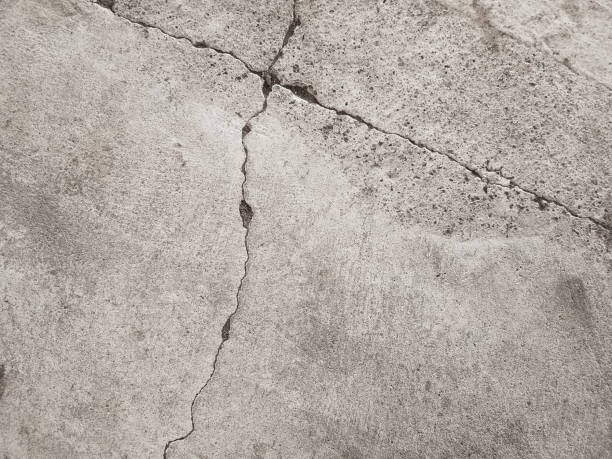 istock Cracked concrete wall texture, Cement background not painted in vintage style 1283479071