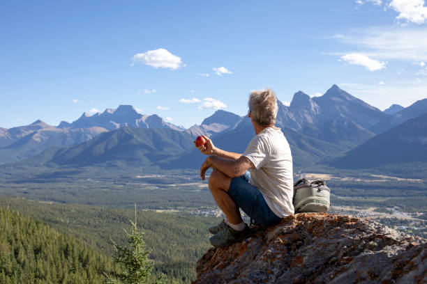 istock Hiker relaxes on mountain ridge in the morning 1283480816
