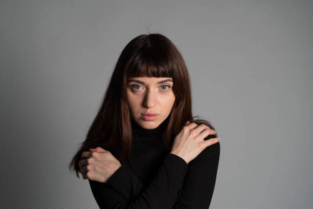 istock Studio portrait of a young woman against plain grey background 1283480881