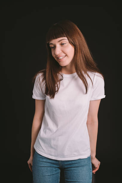 istock Studio portrait of a young woman against plain black background 1283481112