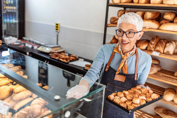 istock Happy business owner working at a coffee shop 1283481119