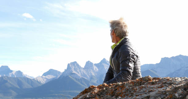 istock Mountaineer relaxes on mountain ridge in the morning 1283481171