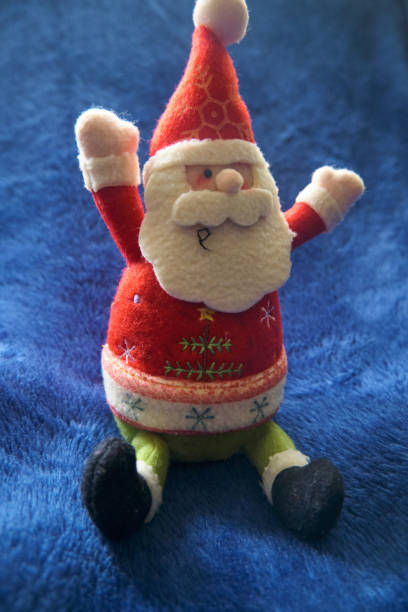 istock Christmas Santa Claus on Blue Background 1283481442