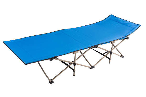istock blue new cot for camping or travel, on white background 1283482587