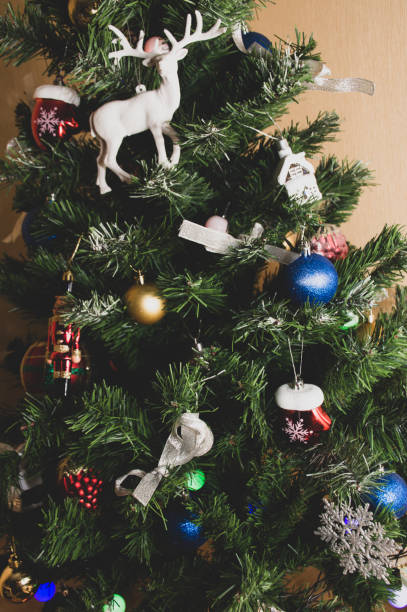 istock christmas tree with ornaments and gifts 1283482593