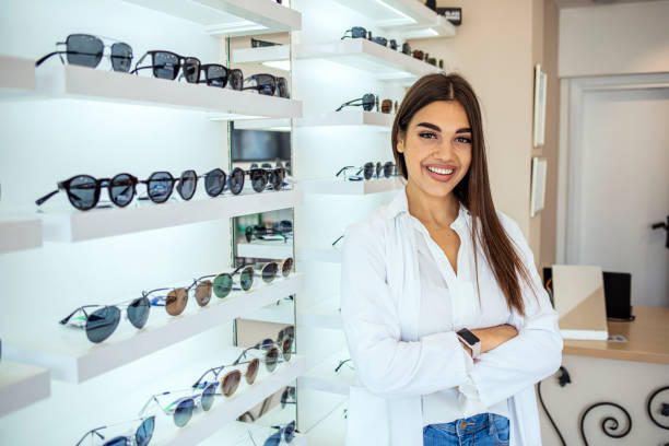 istock Optician selling glasses at the optics. 1283484309