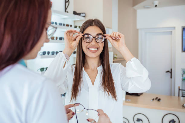 istock Joyful happy woman trying some eyeglasses 1283484486