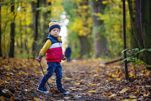 istock Cute toddler child, boy, playing in forest on sunny day 1283484831
