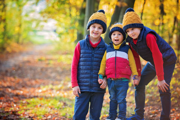 istock Cute toddler child, boy, playing in forest on sunny day 1283485436