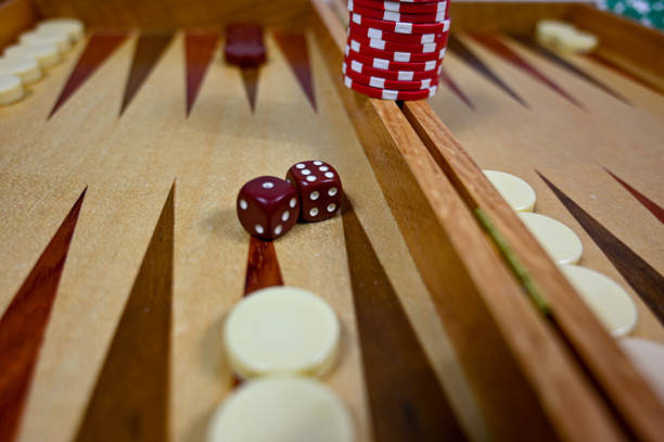 istock backgammon board with game pieces markers and dices 1283485659
