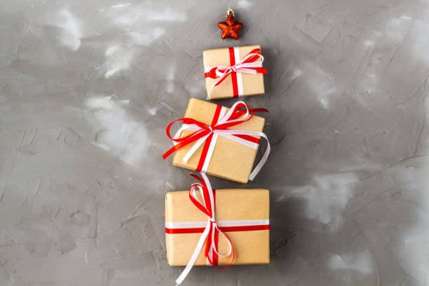 istock gift boxes in the shape of a Christmas tree with a red star. Christmas concept 1283486082