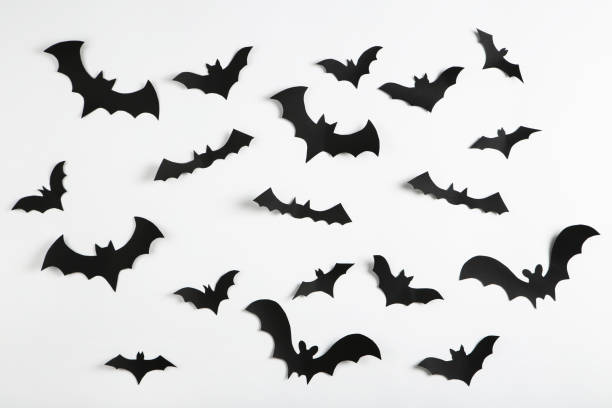 istock Halloween paper bats on gray background 1283486230
