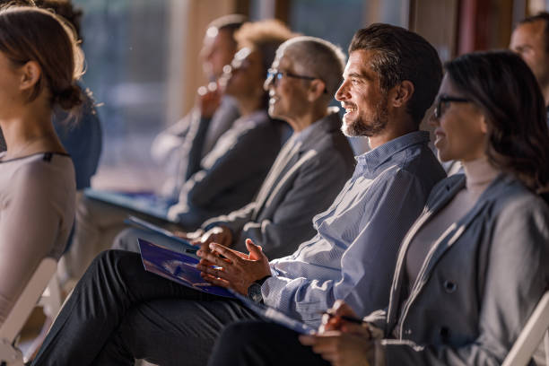 istock Large group of entrepreneurs attending a seminar in board room. 1283488265