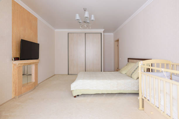 istock Spacious bedroom interior with newborn toddler practice 1283488516