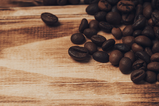 Roasted Coffee beans on wood background