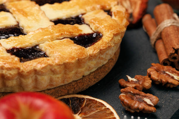istock Berry tart pie on black table close up 1283488656
