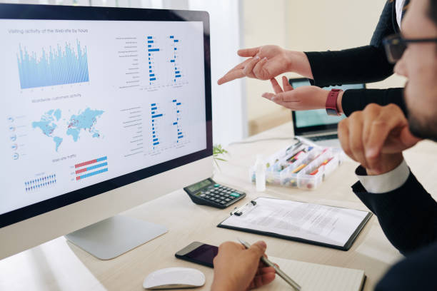 istock Business people discussing financial data 1283489723