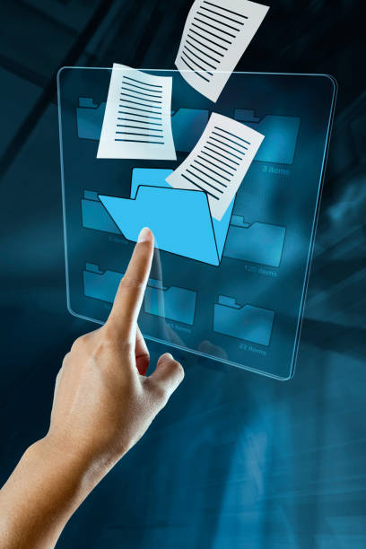 istock a woman hand is searching data in a folder on a digital screen. 1283489981