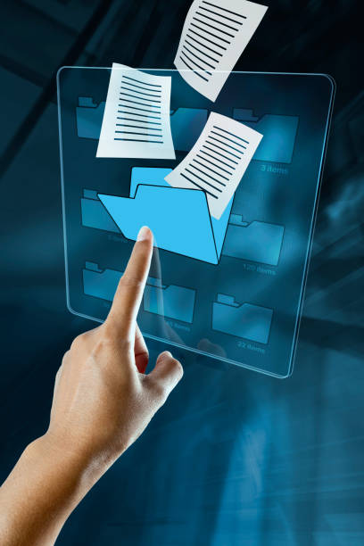 a woman hand is searching data in a folder on a digital screen. stock photo