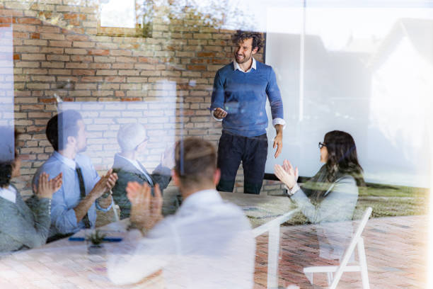 istock Applauding on successful business presentation in the office! 1283490172