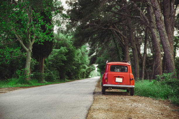istock old red retro car at roadside 1283490929