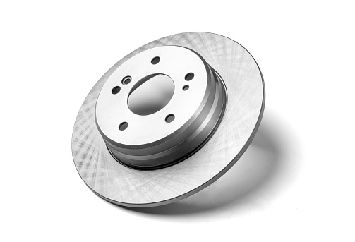Single new brake disc spare part of the car, on white background