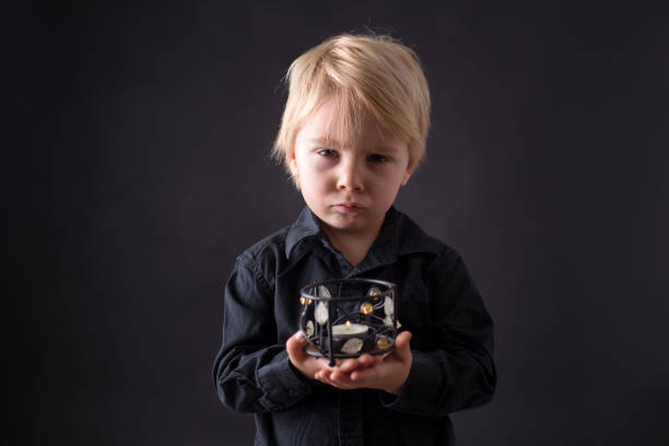 istock Little toddler child, boy praying, isolated background 1283491116