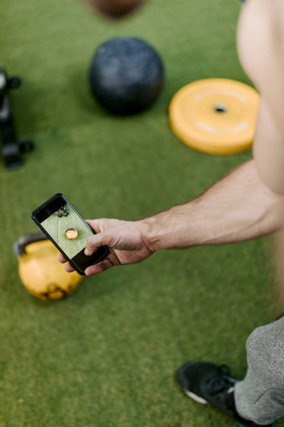 istock Taking pictures at the gym 1283491696