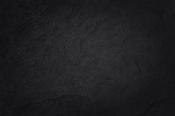 istock Dark grey black slate texture in natural pattern with high resolution for background and design art work. Black stone wall. 1283491856