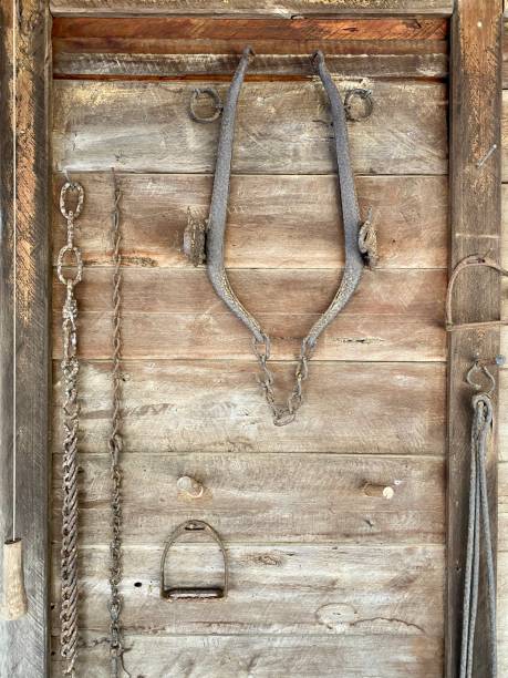 istock Old Farming Tools on a Wooden Wall 1283491869