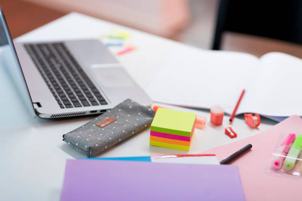 istock Laptop and stationery on table 1283492987
