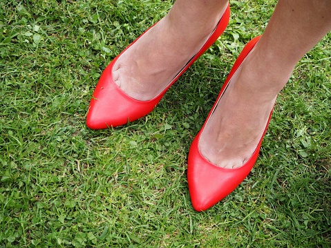 Red shoes on green grass