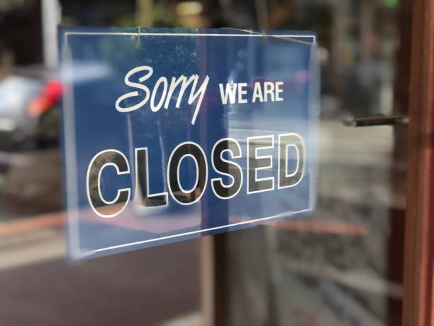 istock Closed sign in a shop front 1283494407