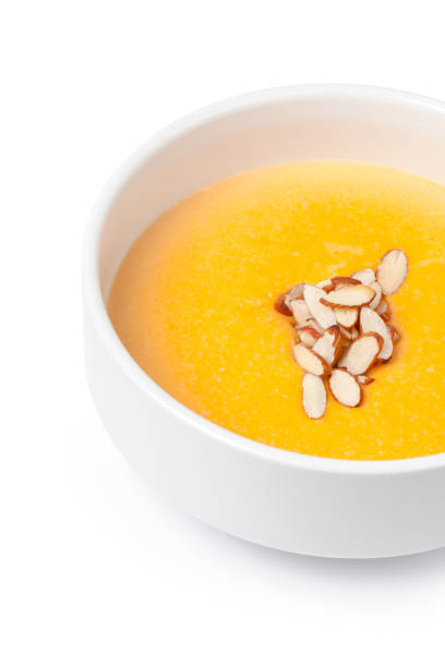 istock Bowl of pumpkin soup isolated on white 1283494708