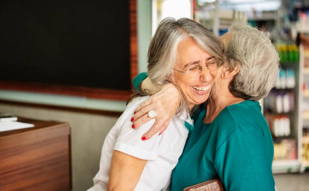 istock Woman embracing female chemist 1283496034