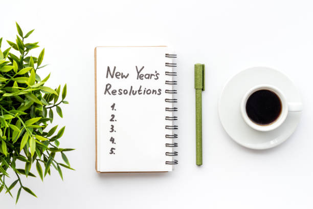 istock New Year Resolutions. Flat lay with Christmas decorations. Overhead view 1283496152