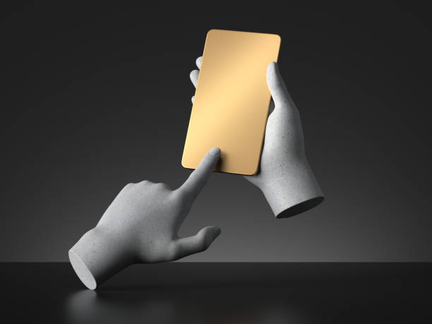 istock 3d render concrete mannequin hands holding golden smart phone gadget, electronic device isolated on black background, minimal concept. Body part. Remote control. Futuristic gadget blank mockup 1283496593