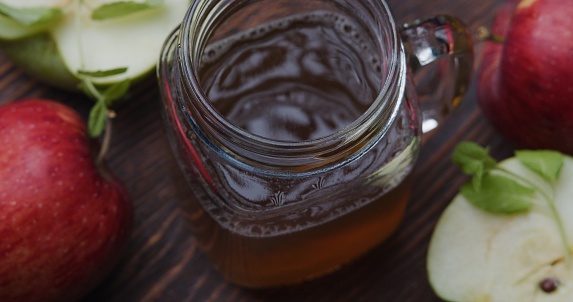 Apple juice in mason jar. Close-up high angle view