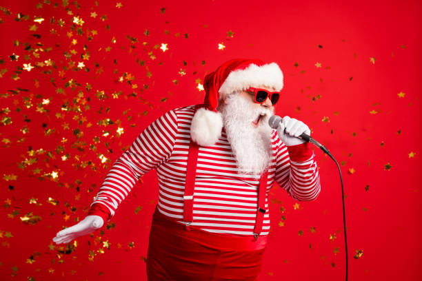 Photo of grandpa grey beard hold mic open mouth scream sing song karaoke wear santa claus x-mas costume suspenders sunglass striped shirt cap isolated red color background Photo of grandpa grey beard hold mic open mouth scream sing song karaoke wear santa claus x-mas costume suspenders, sunglass striped shirt cap isolated red color background singing stock pictures, royalty-free photos & images